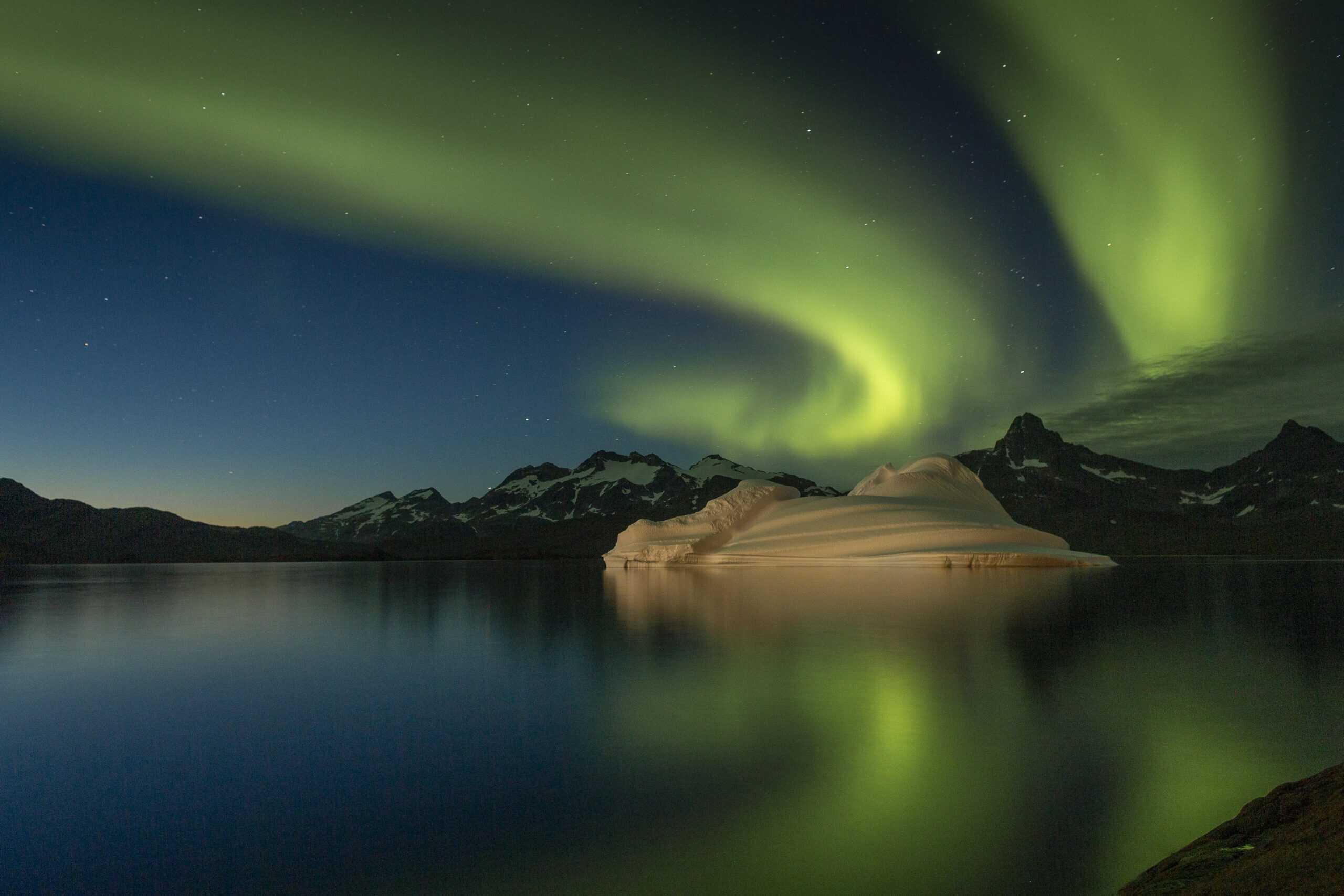 Northern Lights over the fjord. Whale in the fjord. Photo by Lars Anker Møller