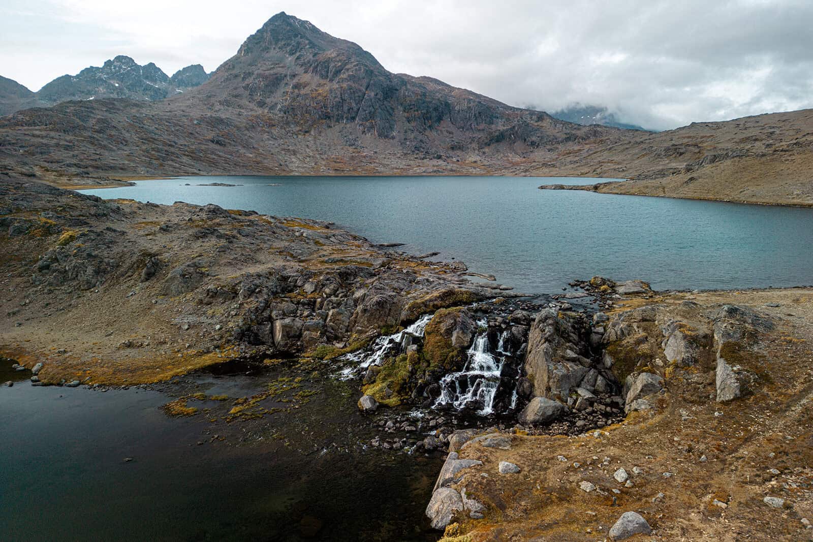 View over the waterfall and lake in the Flower Valley.