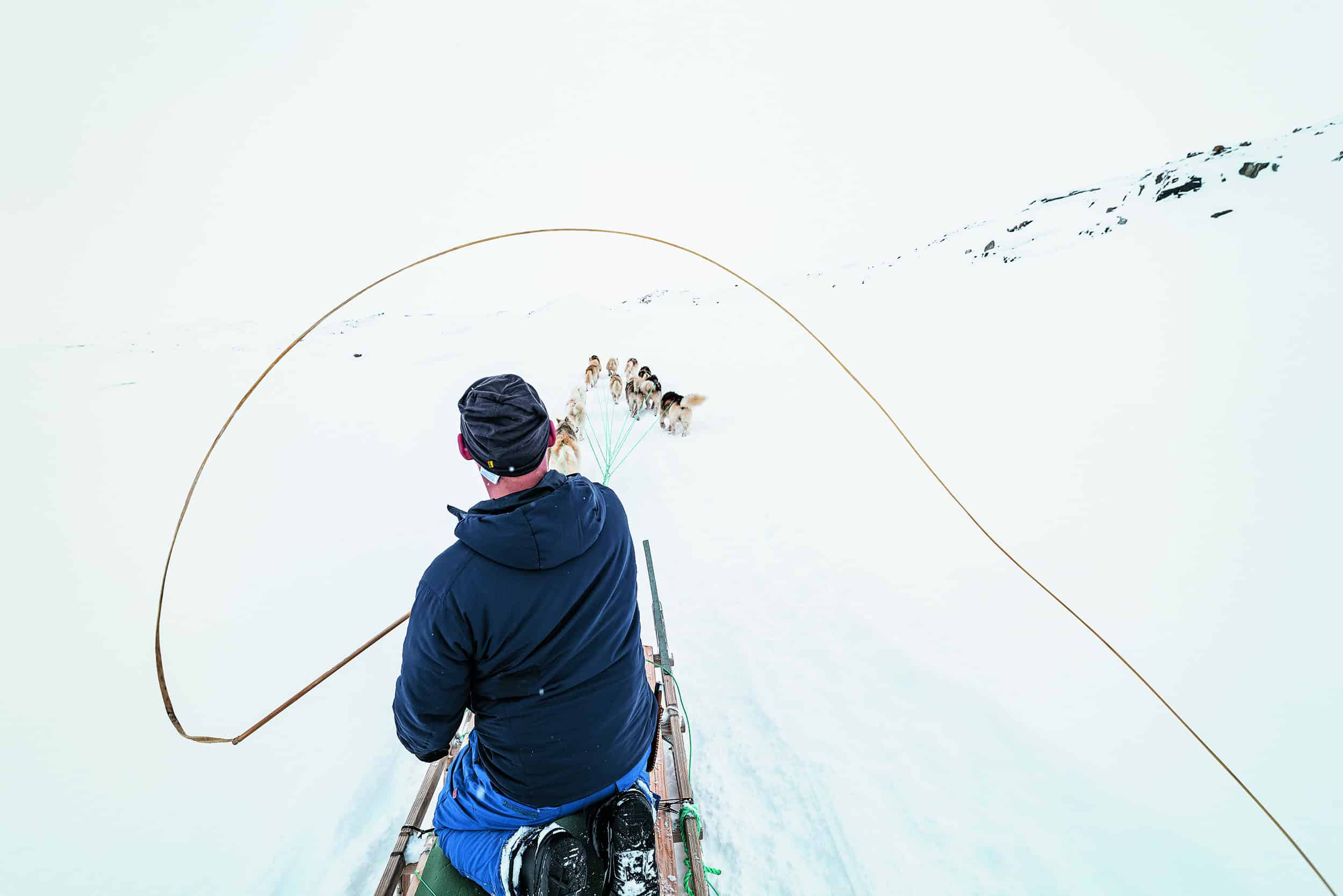 Dog sledding in the backcountry of East Greenland - Photo by Carsten Egevang - Visit East Greenland