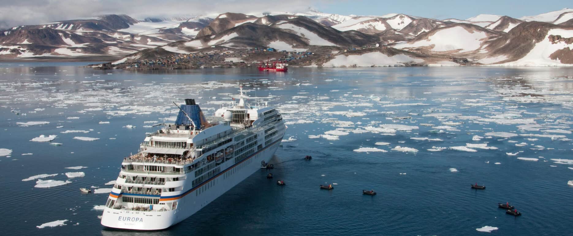 The cruise ship Europa anchored outside Ittoqqortoormiit in East Greenland. Photo: Frank Petersen - Visit Greenland