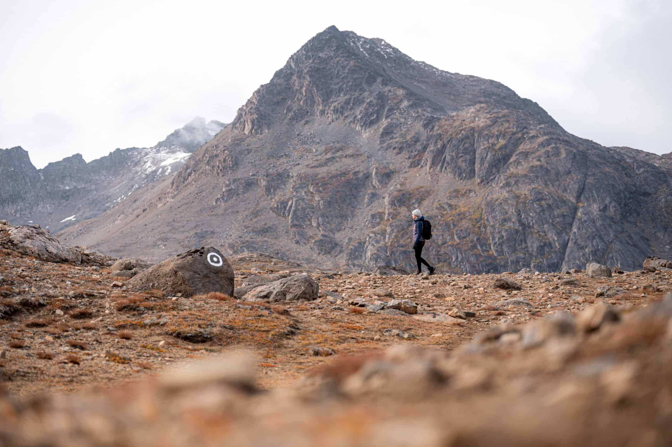 Hiking along marked route in the Ammassalik area.