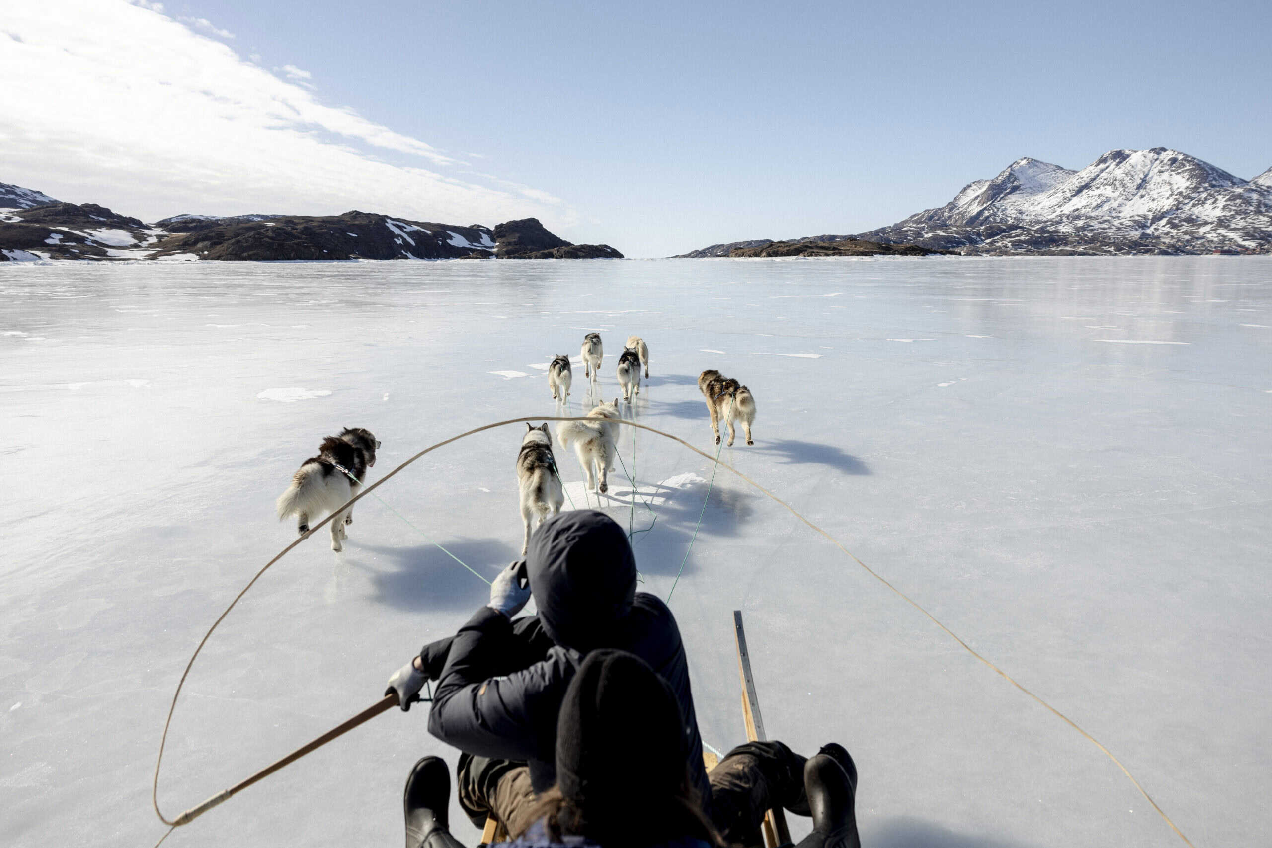 Dog sledding on the frozen fjord in Tasiilaq.
