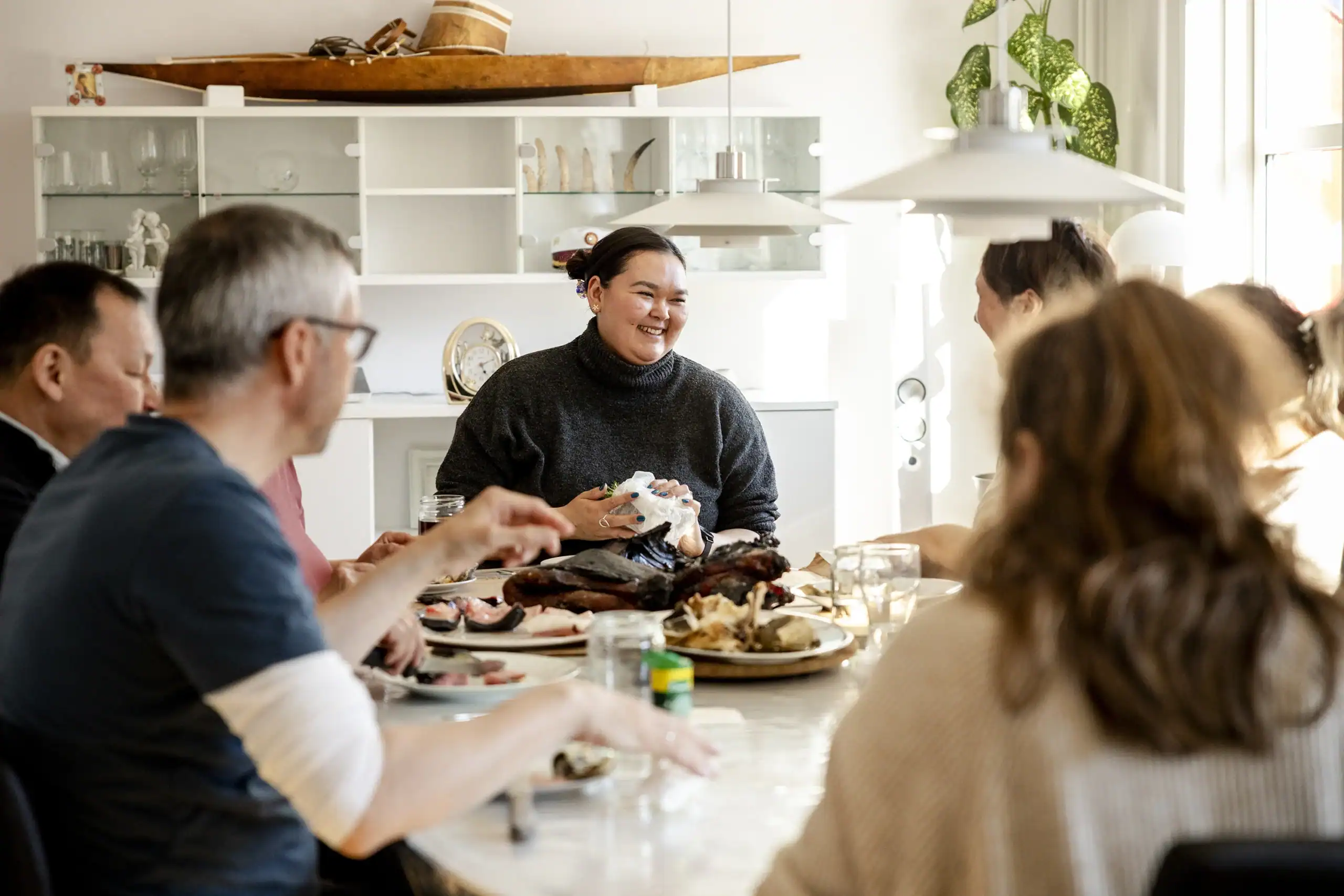 Eating at a private home in Tasiilaq, East Greenland.