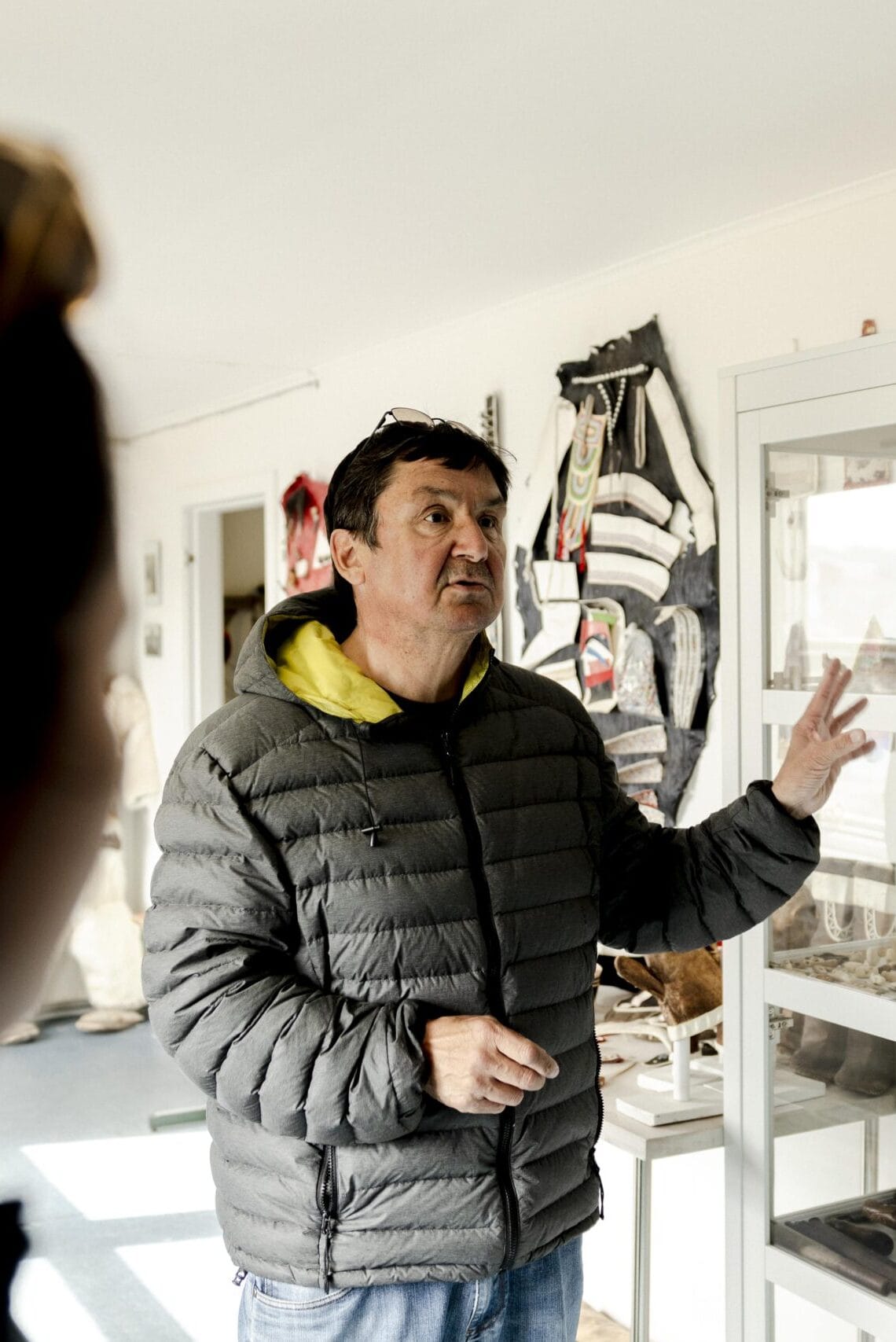 Owner of the family-owned Kulusuk museum explaining their exhibition.