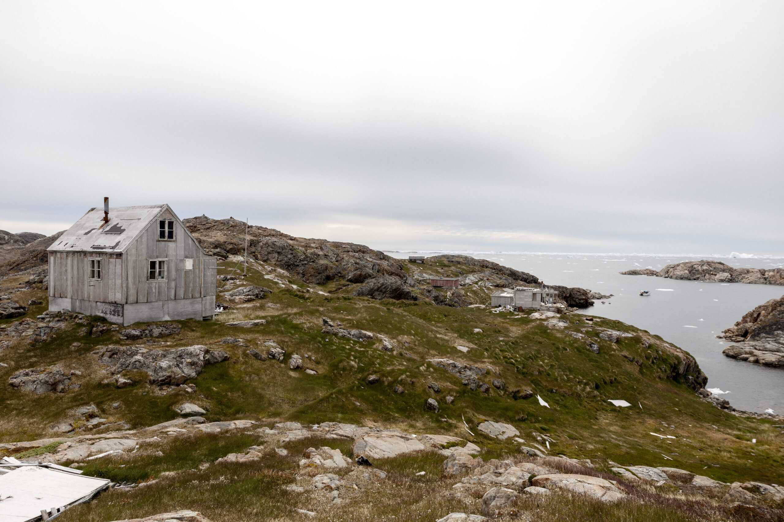 View of abandoned house at Ikateq towards Sermilik Fjord.