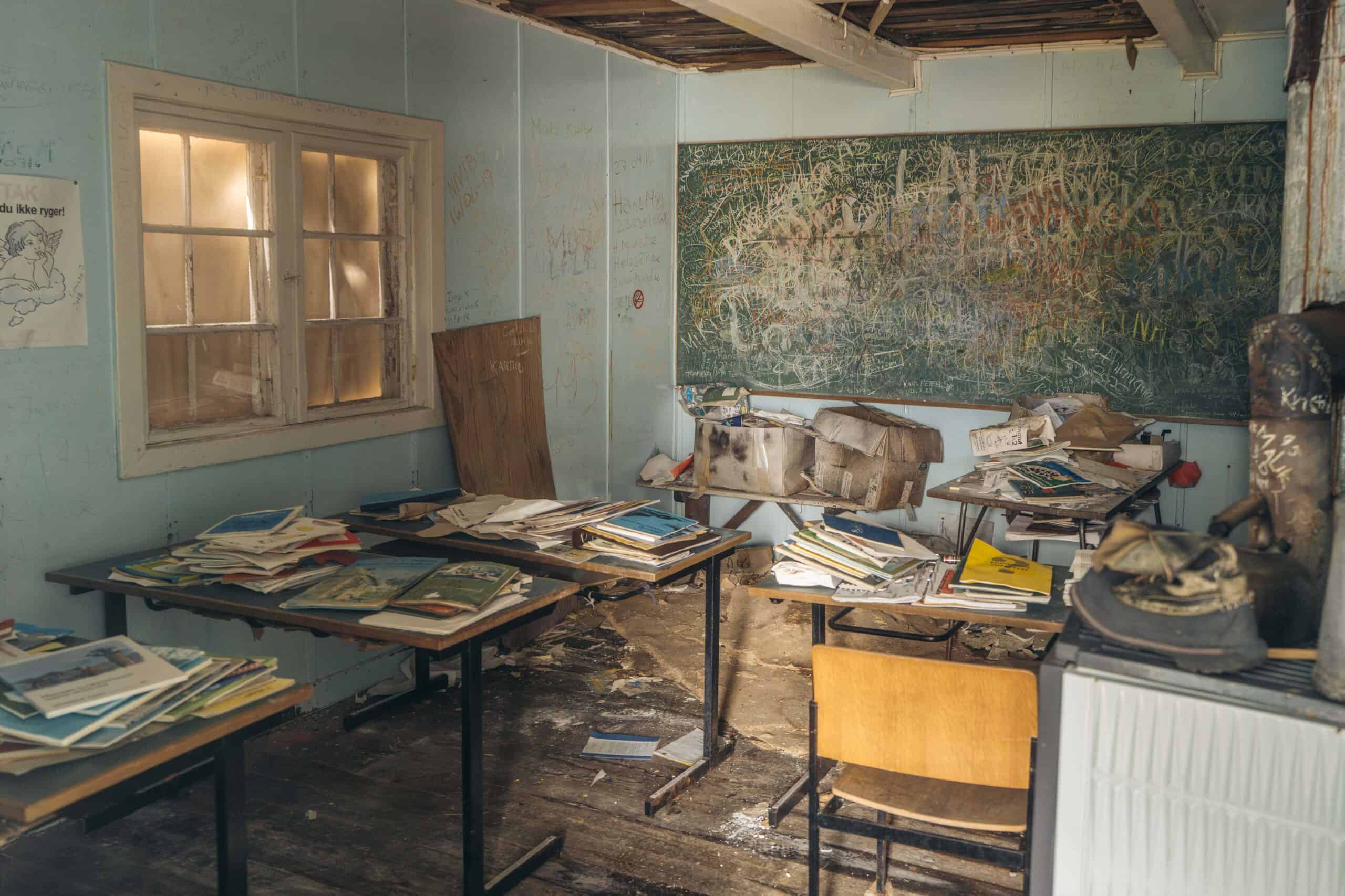 Inside the old classroom of the school at the abandoned settlement Ikateq.