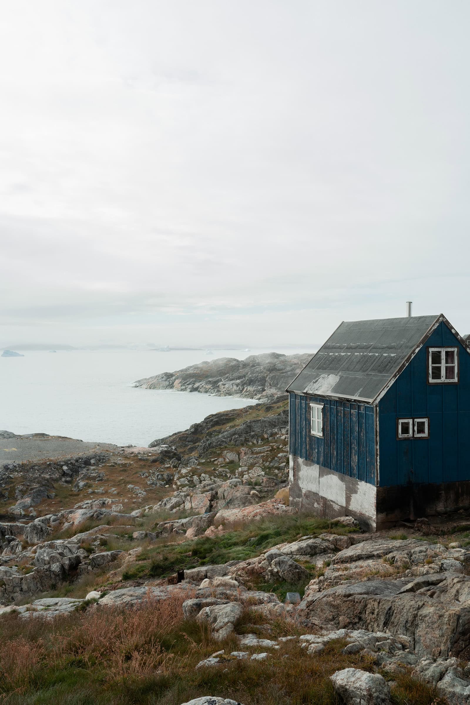 The house overlooking the helipad and fjord in Sermiligaaq.