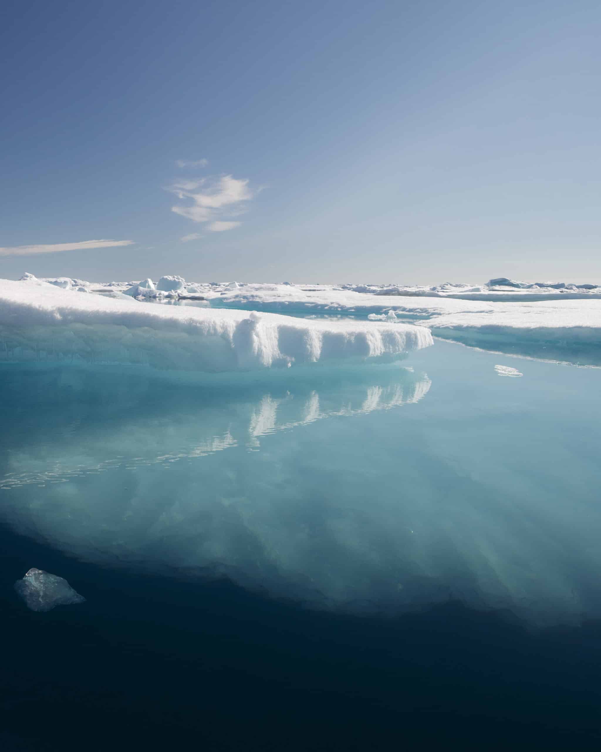 What's visible here is only the top few metres of a larger shelf of ice, most of it out of sight below the surface.