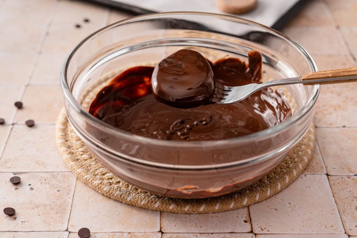 this shows me dipping the egg into the chocolate