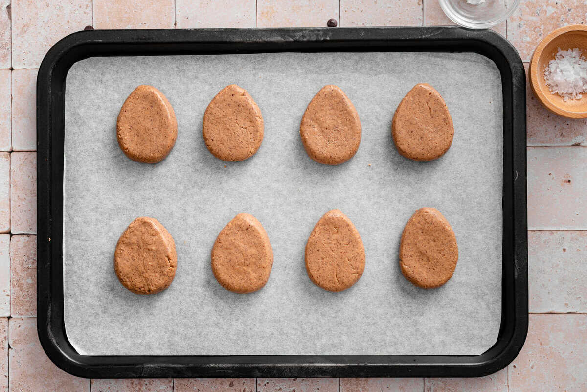 this shows me adding the eggs to a parchment lined baking sheet.