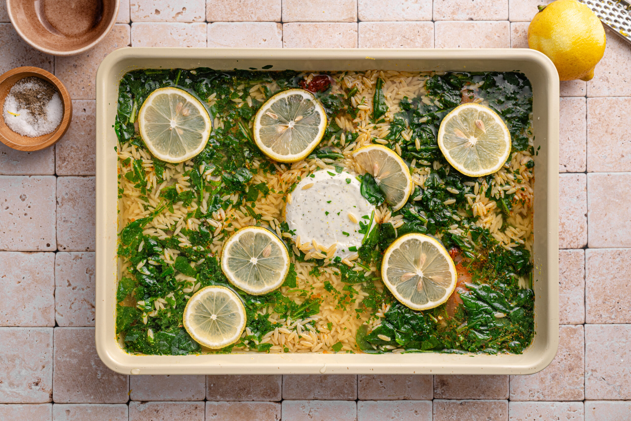 Overhead shot of added orzo to the recipe.