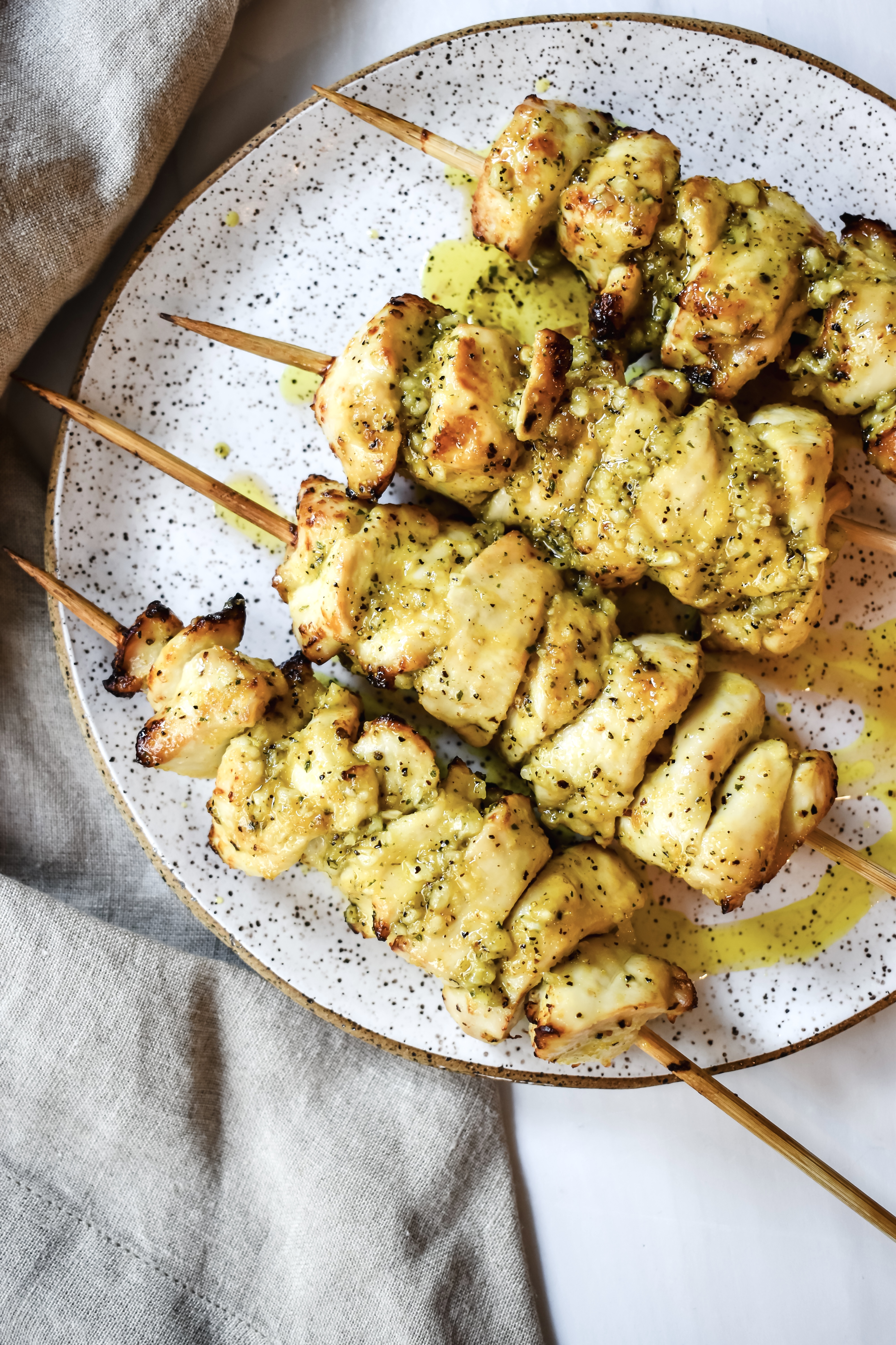 this is an overhead view of my lemon pepper chicken kabobs with melted garlic butter. 
