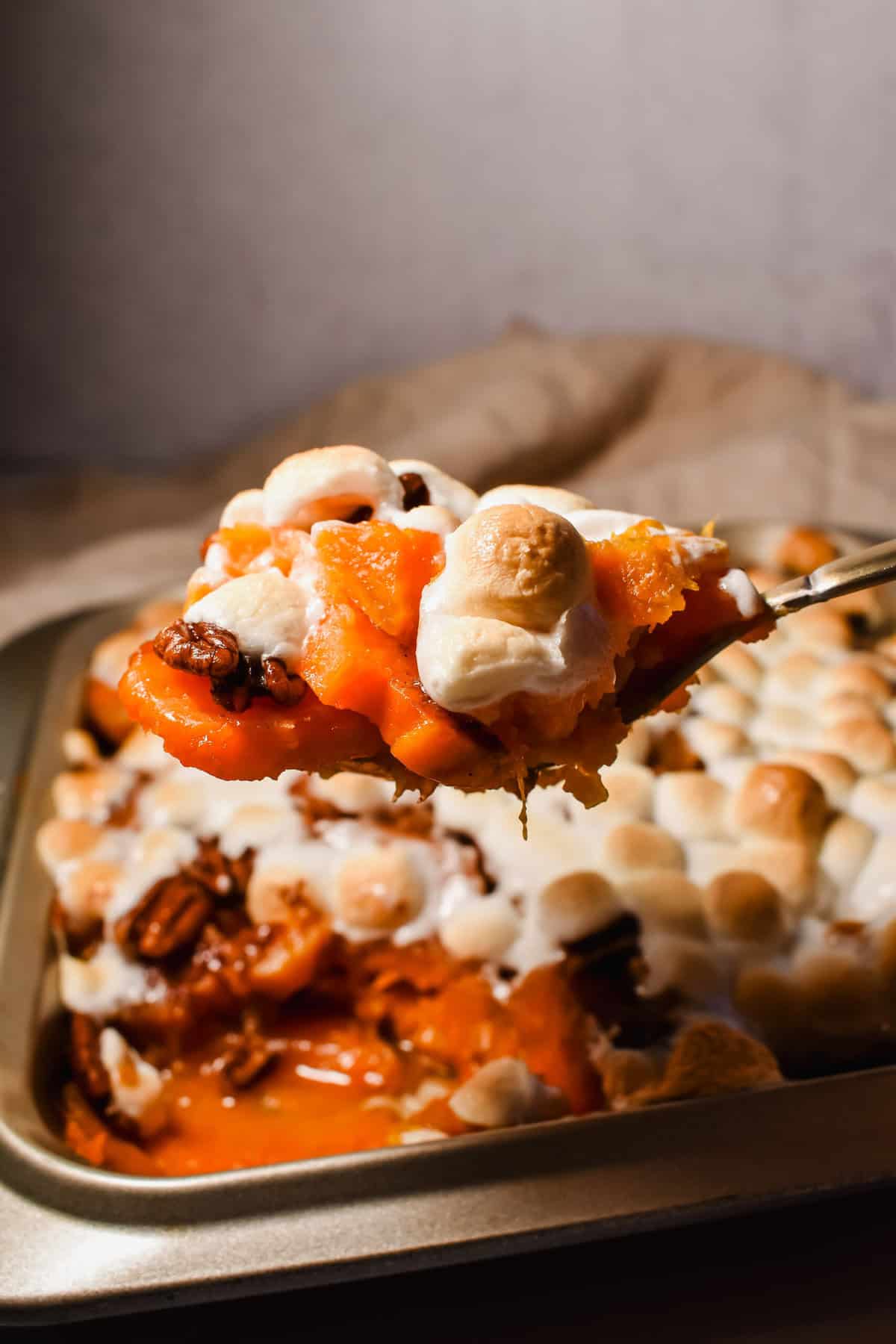 this is a side view of a scoop of my candied yams recipe. 