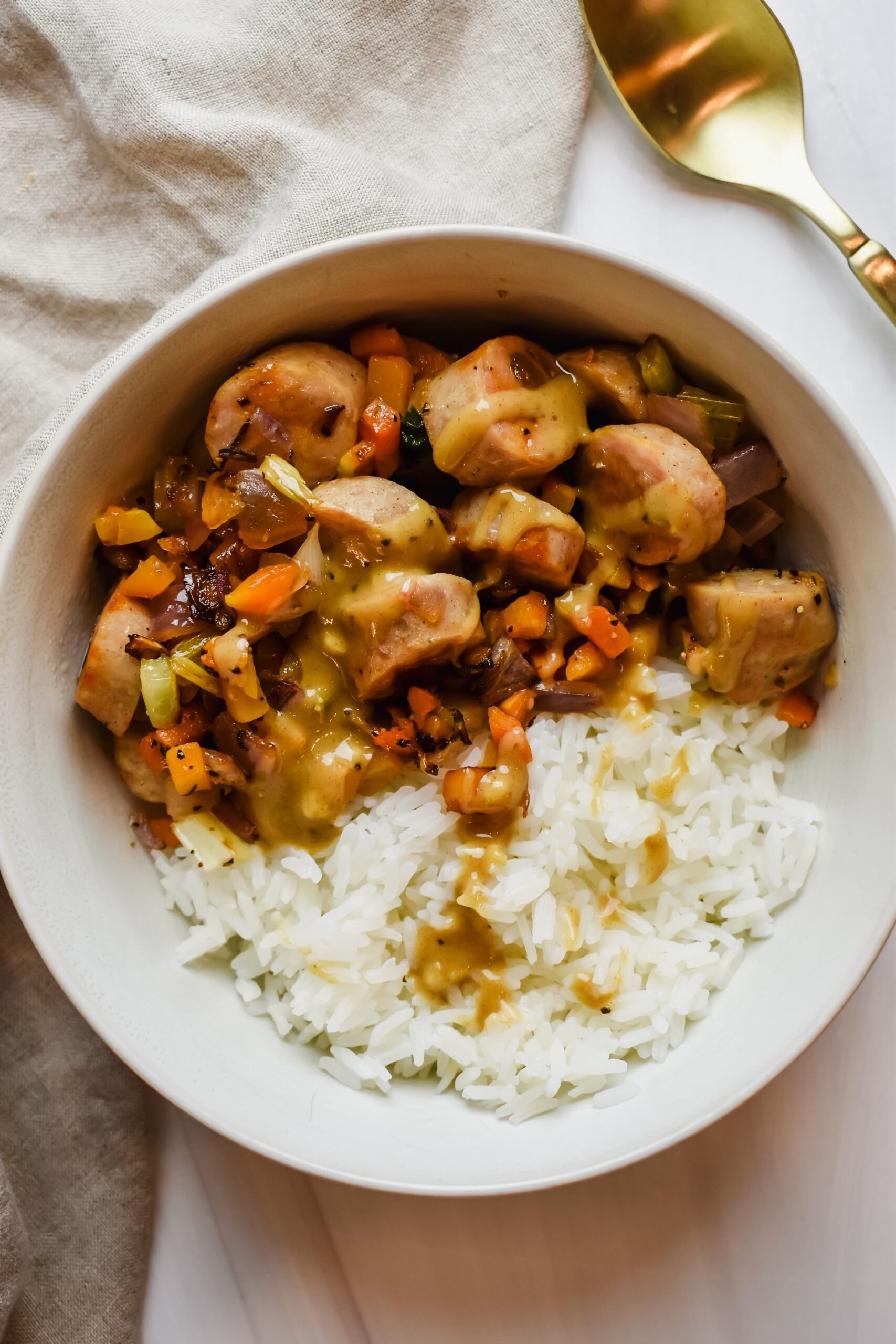 this is a close up of my trader joe's holiday hash bowl with drizzled honey mustard sauce 