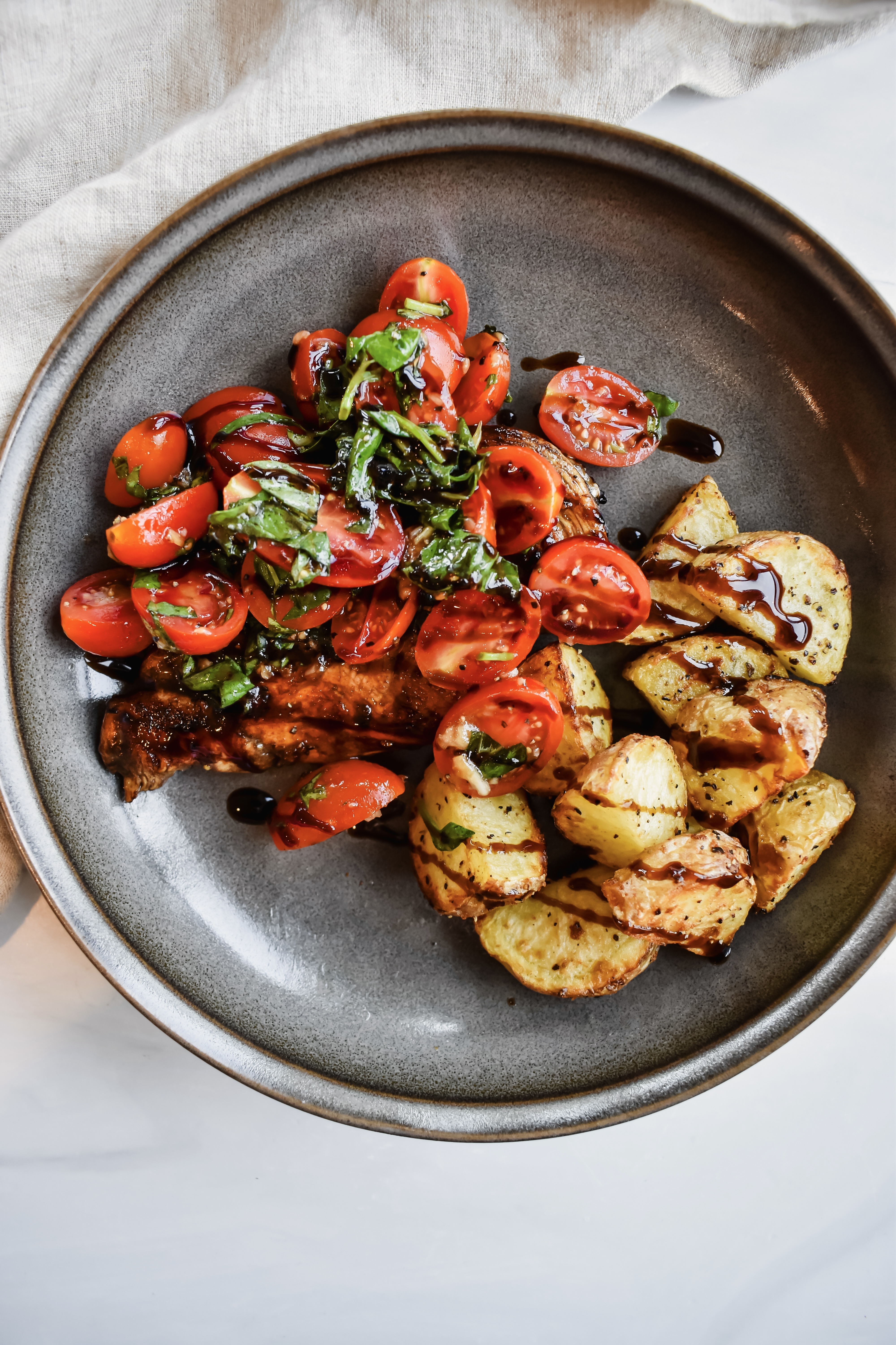 this is a top view of my bruschetta chicken with roasted potatoes. 