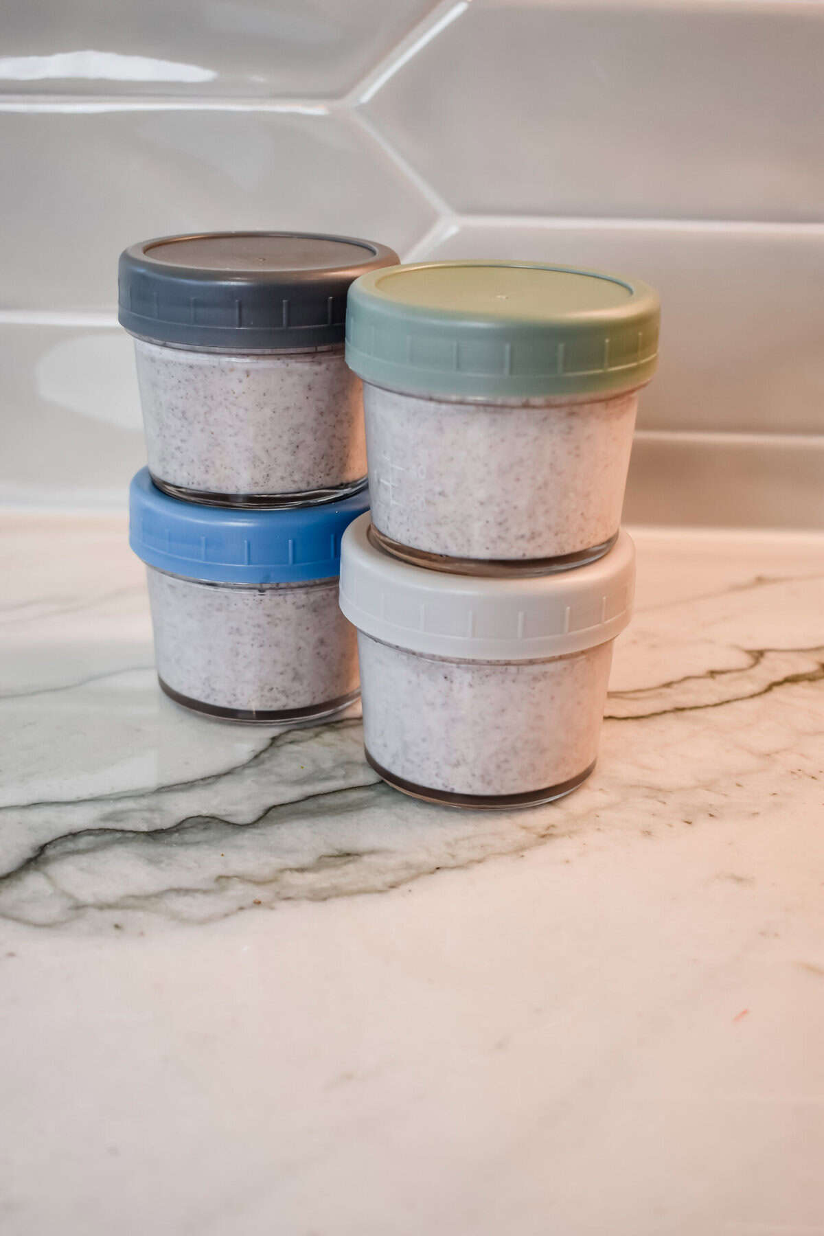 this shows the jars stacked up on top of each other ready to go in the fridge.