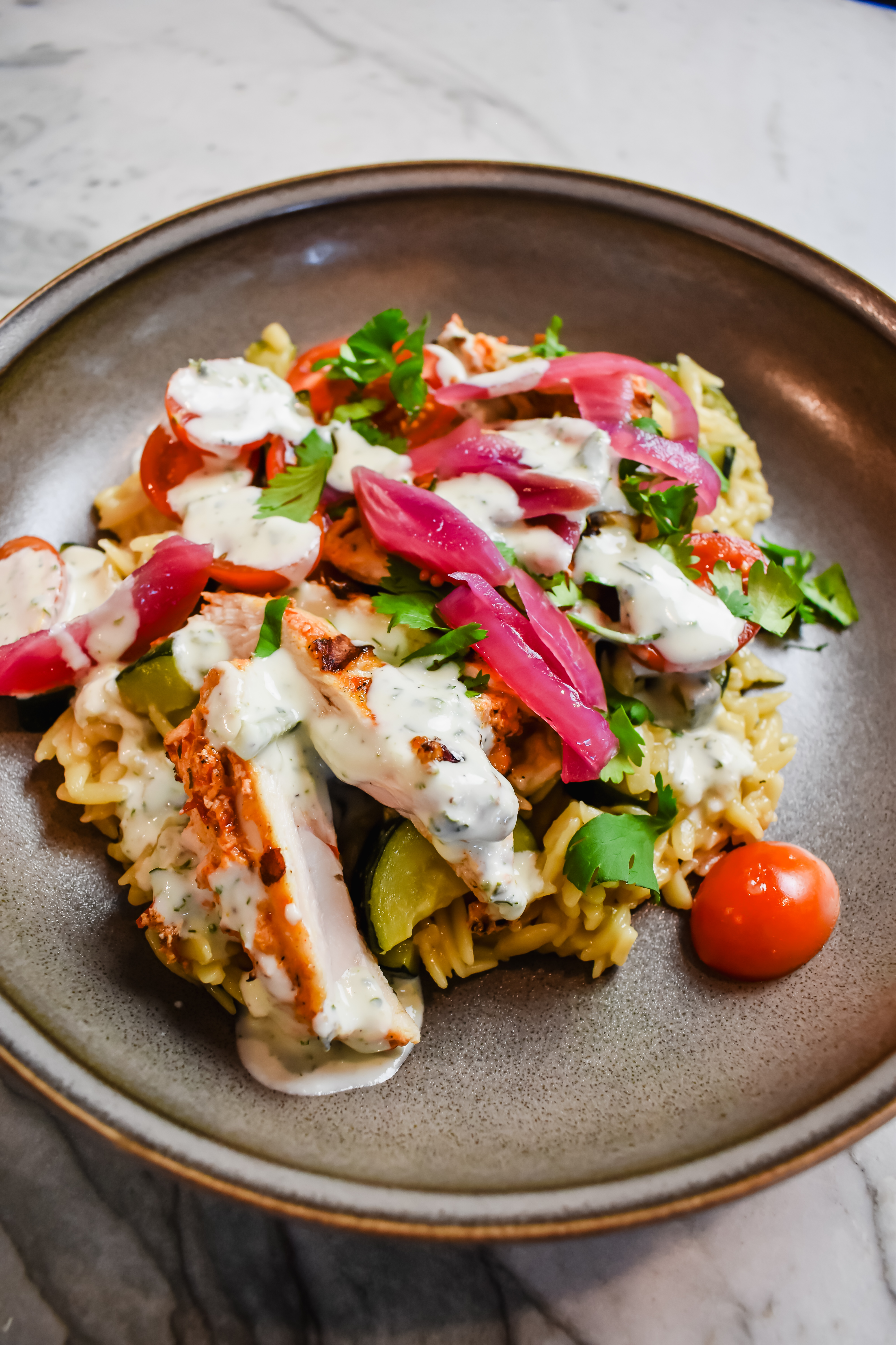 This is a side view close up of my trader joe's harissa chicken bowls 