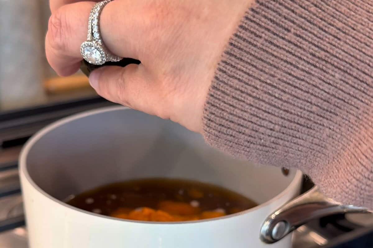 this shows me adding all of the ingredients into the pot. 