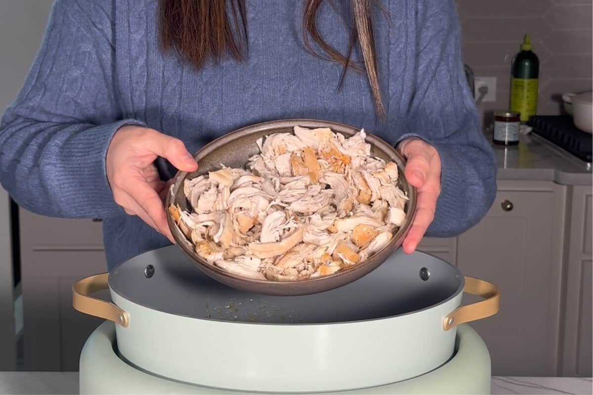 this shows me with the cooked shredded chicken, about to add it back in 