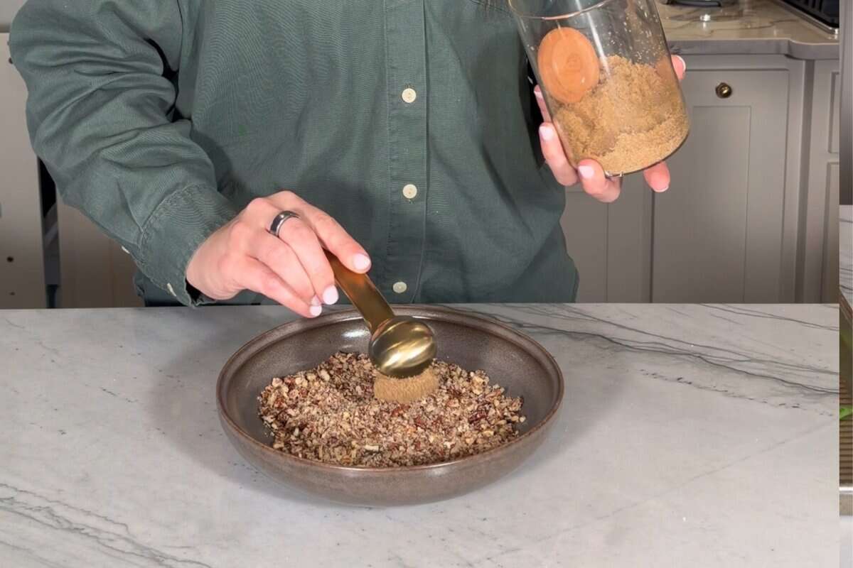 adding brown sugar to the crushed pecan mixture 