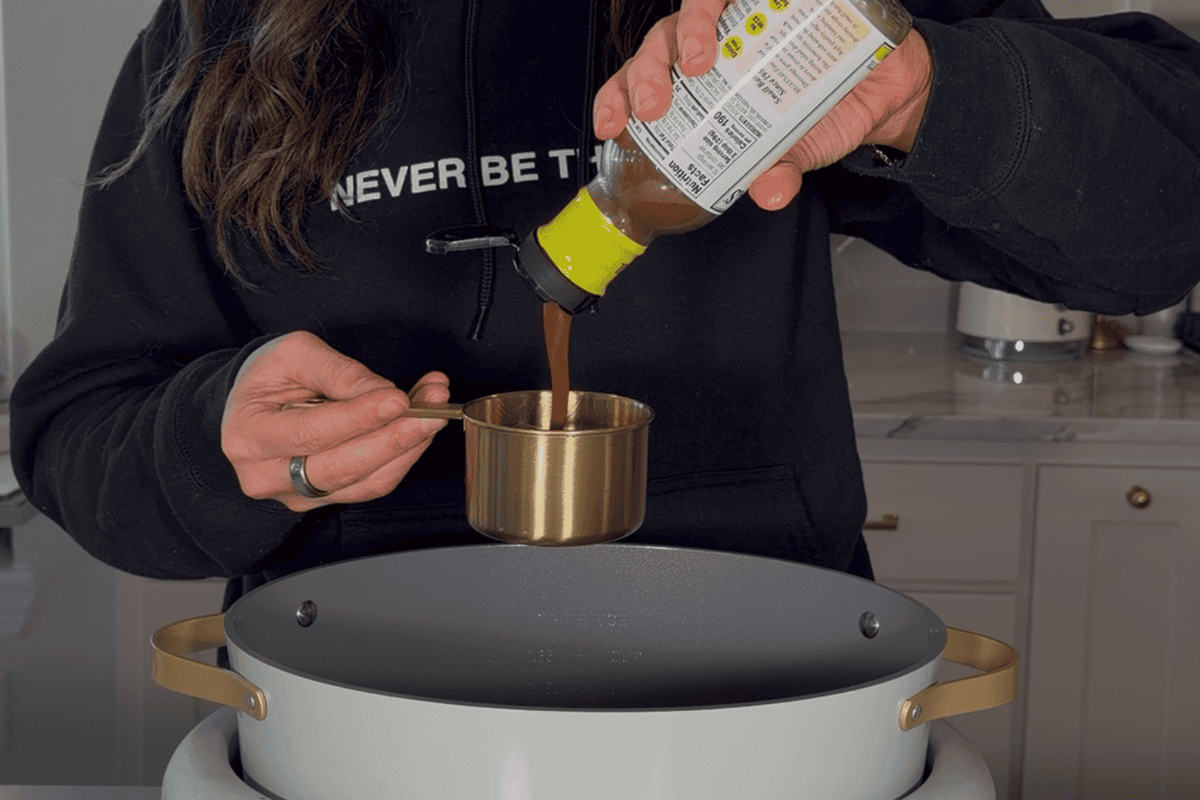 Adding all ingredients in for the slow cooker balsamic chicken.