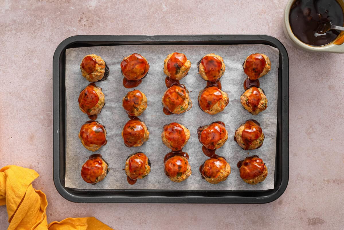 this shows me adding the teriyaki sauce on the meatballs after cooking 