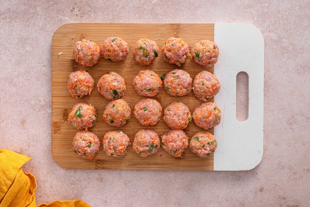 this shows the meatballs being formed into balls 