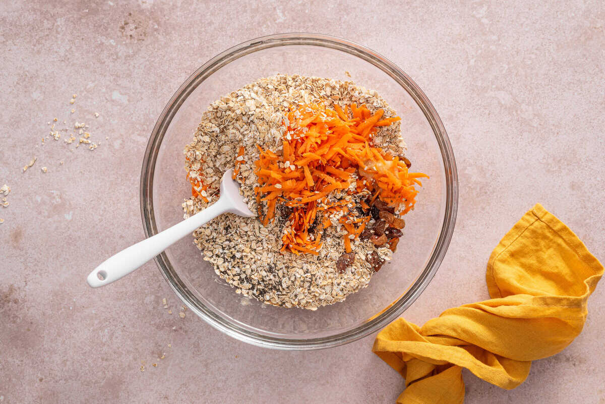 All ingredients in mixing bowl for carrot breakfast cookies.
