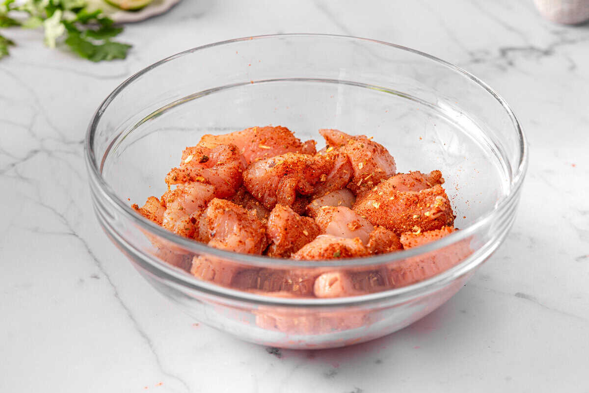 this shows the seasoned chicken in a bowl 