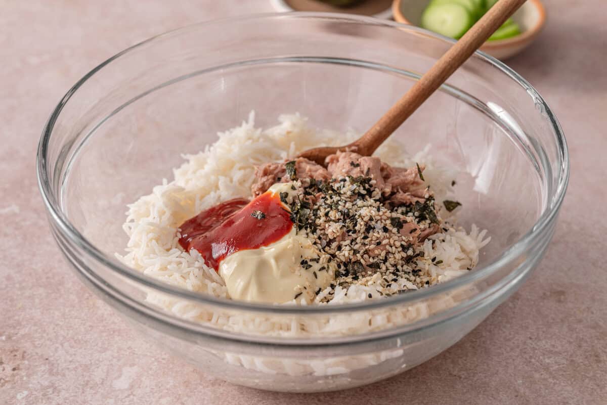 side view of the rice and sushi an seasoning in a bowl. 