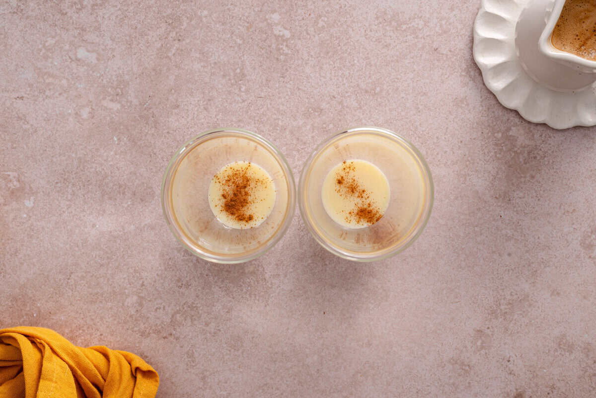 this shows the condensed milk and cinnamon in a tall glass. 
