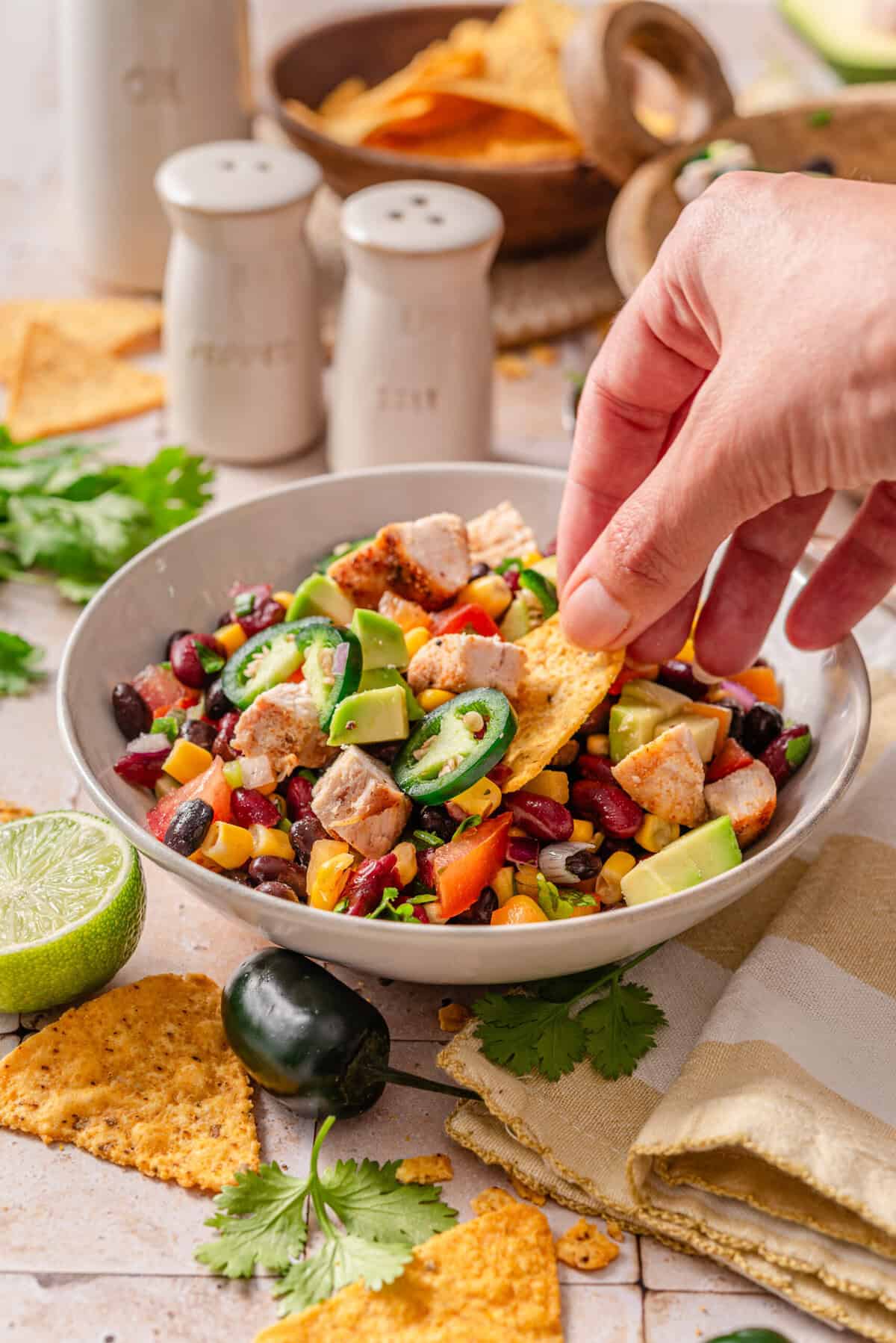 Side angle shot of my cowboy caviar salad dipped with chips.