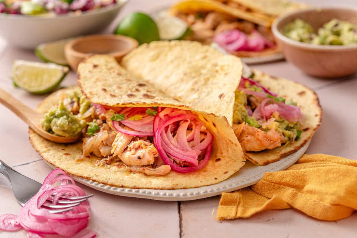 Side shot of chicken tinga tacos.