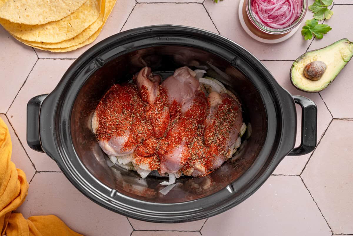 Overhead shot of chicken in crock pot.