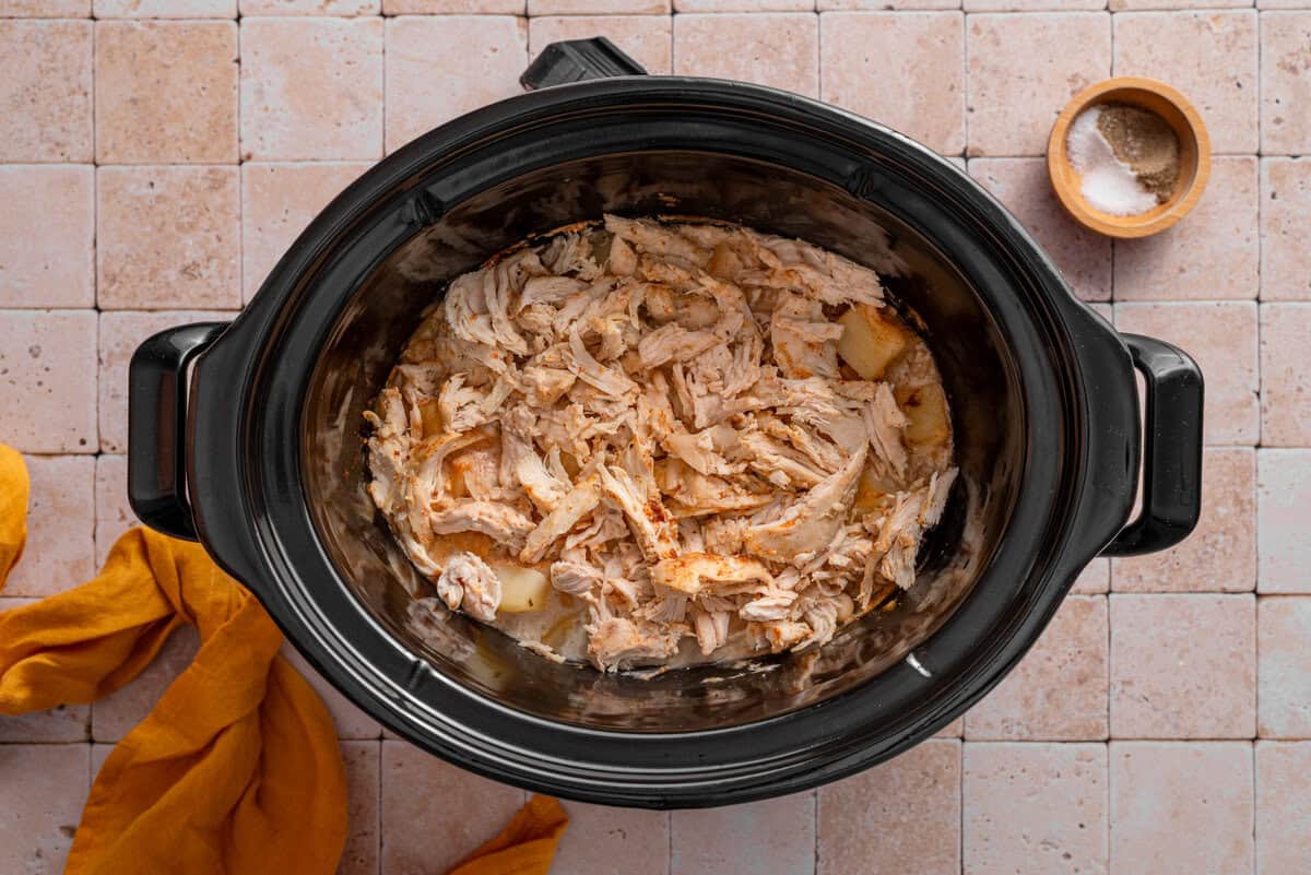 Overhead shot of cooked chicken shredded.