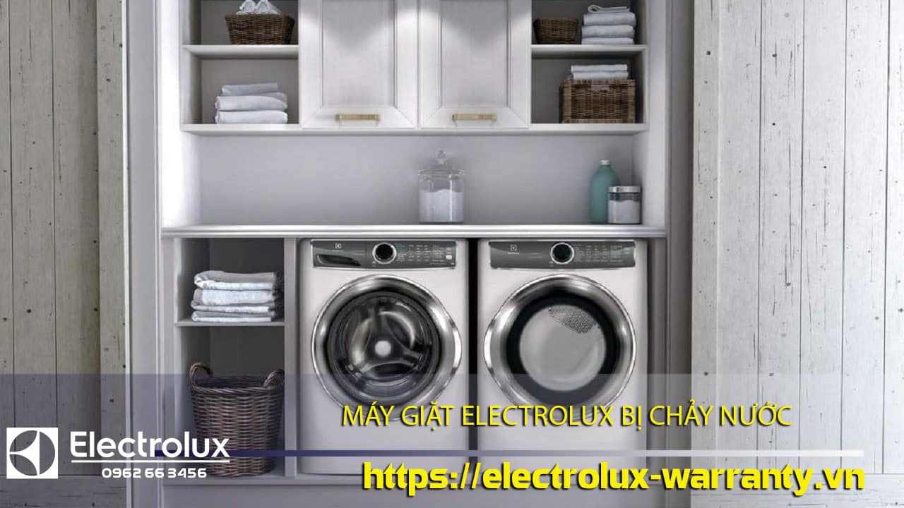 Waterproof Electrolux washing machine under repair in laundry room with shelves and towels.