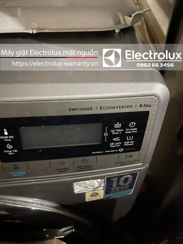 ELECTROLUX washing machine with warranty sticker, front view showcasing controls and branding, emphasizing appliance repair and warranty services for Electrolux home appliances.