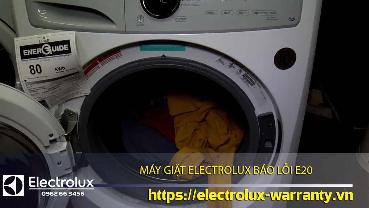 Electric front-loading washing machine with damage warning label, part of Electrolux warranty support.