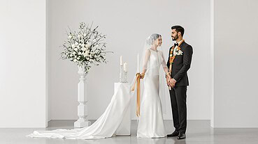 Bride and groom exchanging vows during elegant wedding ceremony.