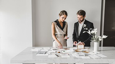 Elegant wedding planning with a couple reviewing design options.