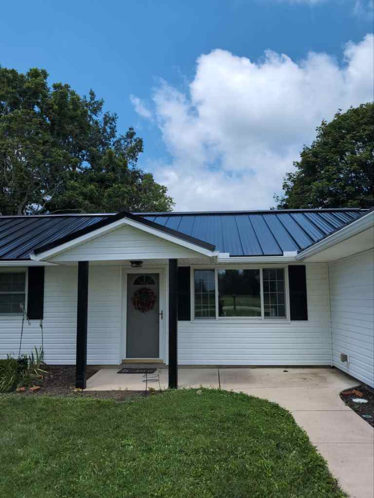 Metal roofing installation on a residential house, showcasing durable and weather-resistant roofing solutions. Perfect for enhancing roof longevity and curb appeal.