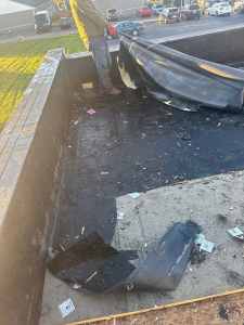 Roofing damage and repair, black roofing membrane, roofing contractor fixing roof, roof tear-off, roofing materials, roof maintenance, flat roof repair, residential roofing services, commercial roofing solutions, roof leak repair, roofing installation, roof replacement, sheet metal flashing, roofing debris cleanup, elevated roofing and siding logo.