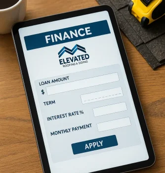 Loan application form on digital device for roofing and siding financing, with home improvement tools and coffee cup on wooden table.