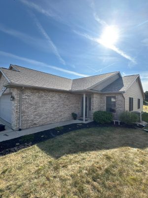 Enhanced residential roofing and siding with durable materials, featuring a clean, modern look and expertly installed roof.