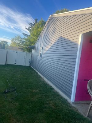 Newly installed vinyl siding on home exterior enhances curb appeal and protects against weather. Professional siding installation by Elevated Roofing and Siding ensures durability and aesthetic value.