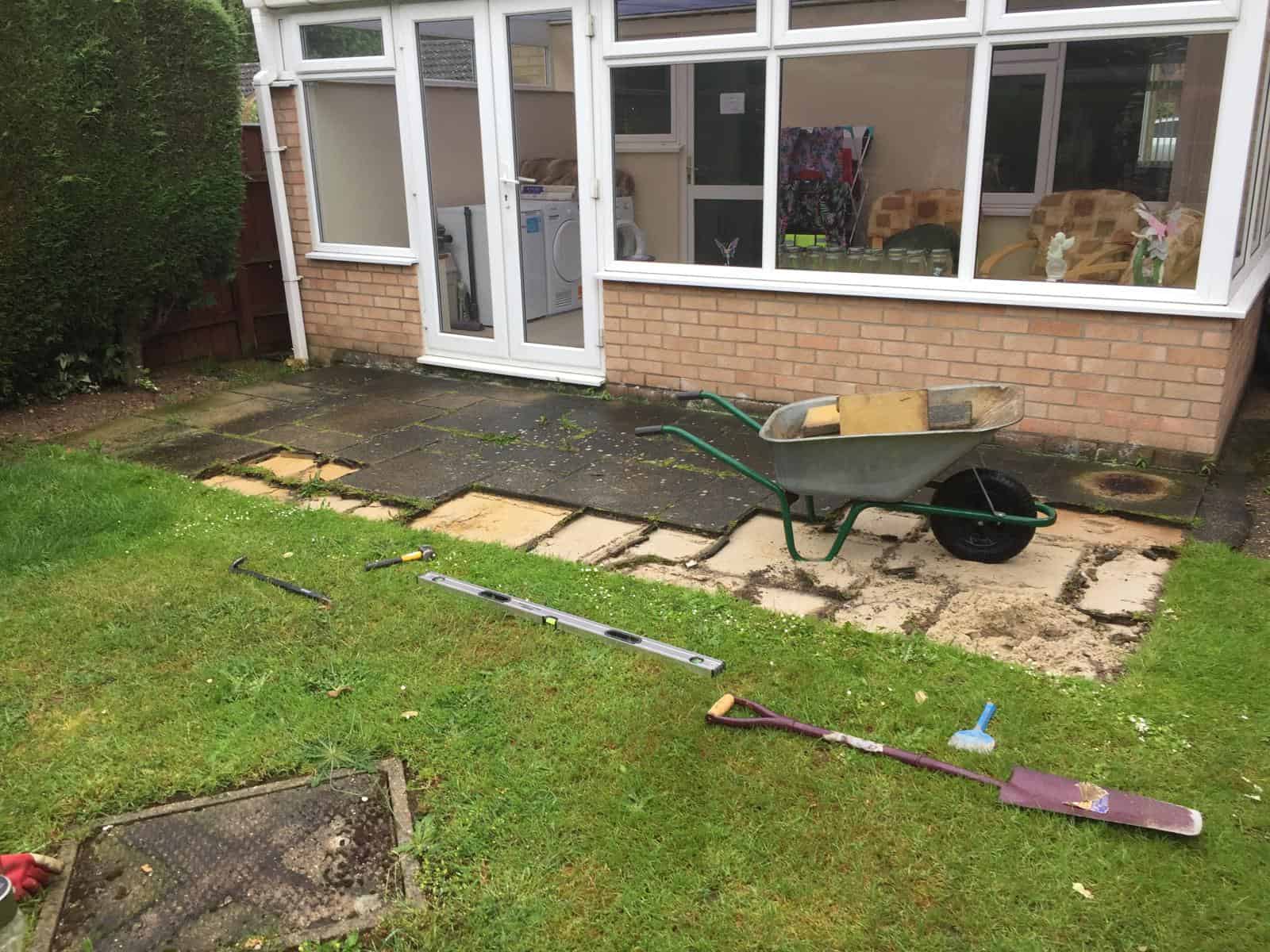 New patio paving being installed outside a house in Suffolk.