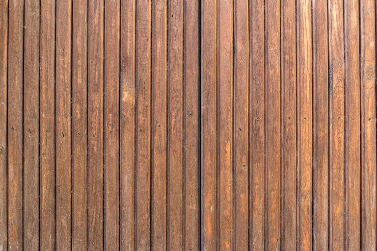 Close-up of wooden garden fence panels for privacy and security.