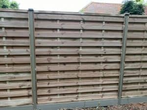 New wooden garden fence with Durapost posts and horizontal slats.