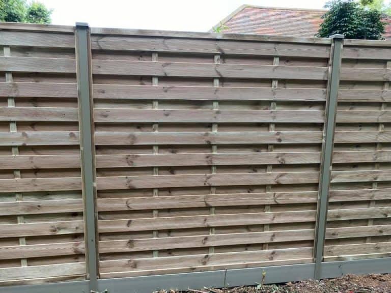 New wooden garden fence with Durapost posts and horizontal slats.