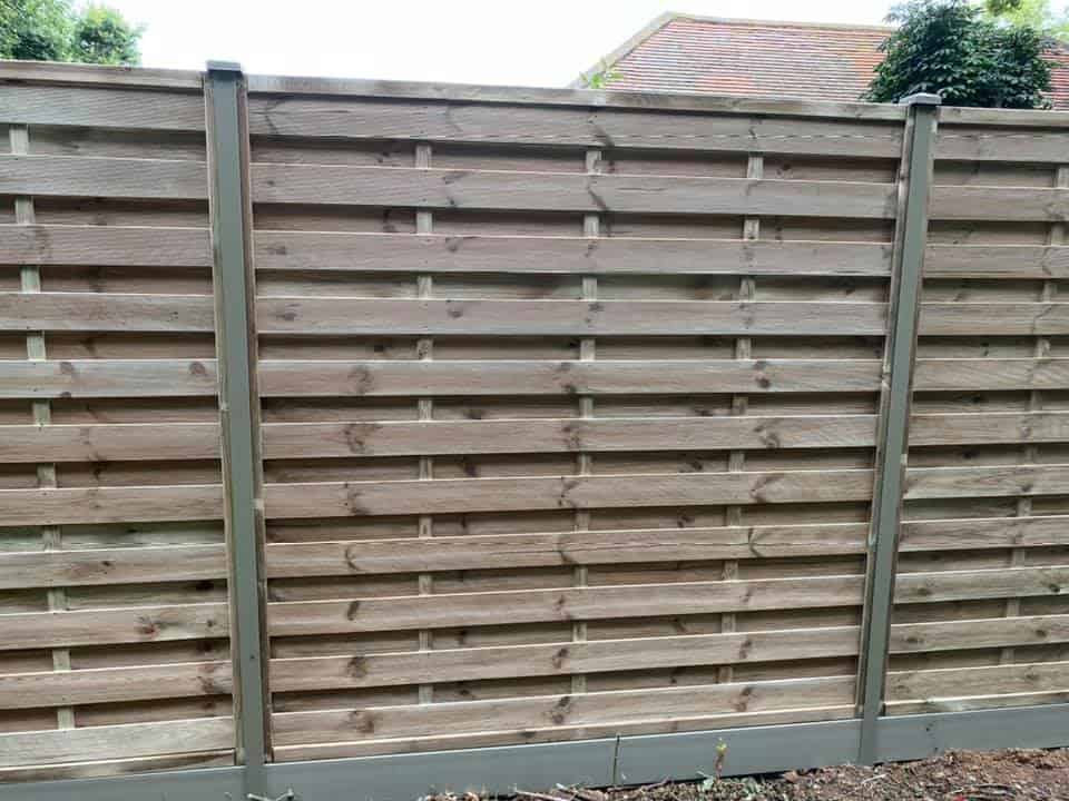 New wooden garden fence with Durapost posts and horizontal slats.